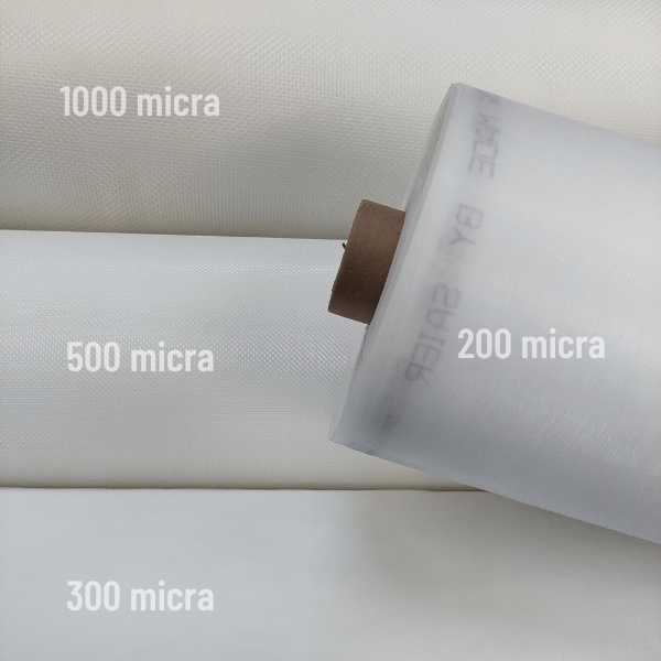 Rolos de telas de nylon micronadas alinhados com identificação das medidas de 1000, 500, 300 e 200 micra, evidenciando as diferentes granulometrias de filtração.