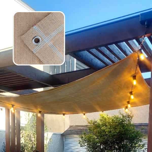 tela shade cor areia com acabamento reforçado instalada em pergolado